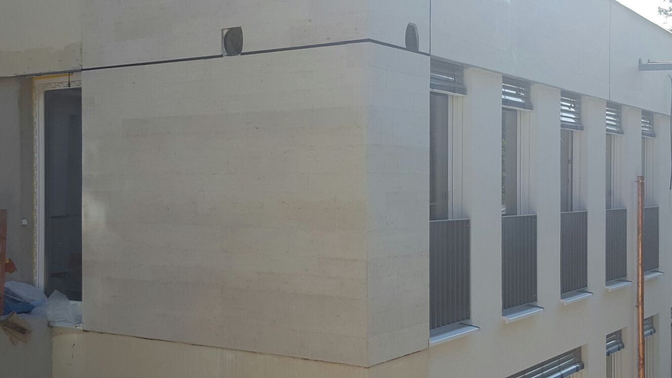 WDVS und Vorhangfassade mit Naturstein in Mannheim